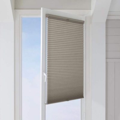 The TrackGlide™ feature on Duette® Honeycomb Shades keeps the shade in place when you open or close the door.